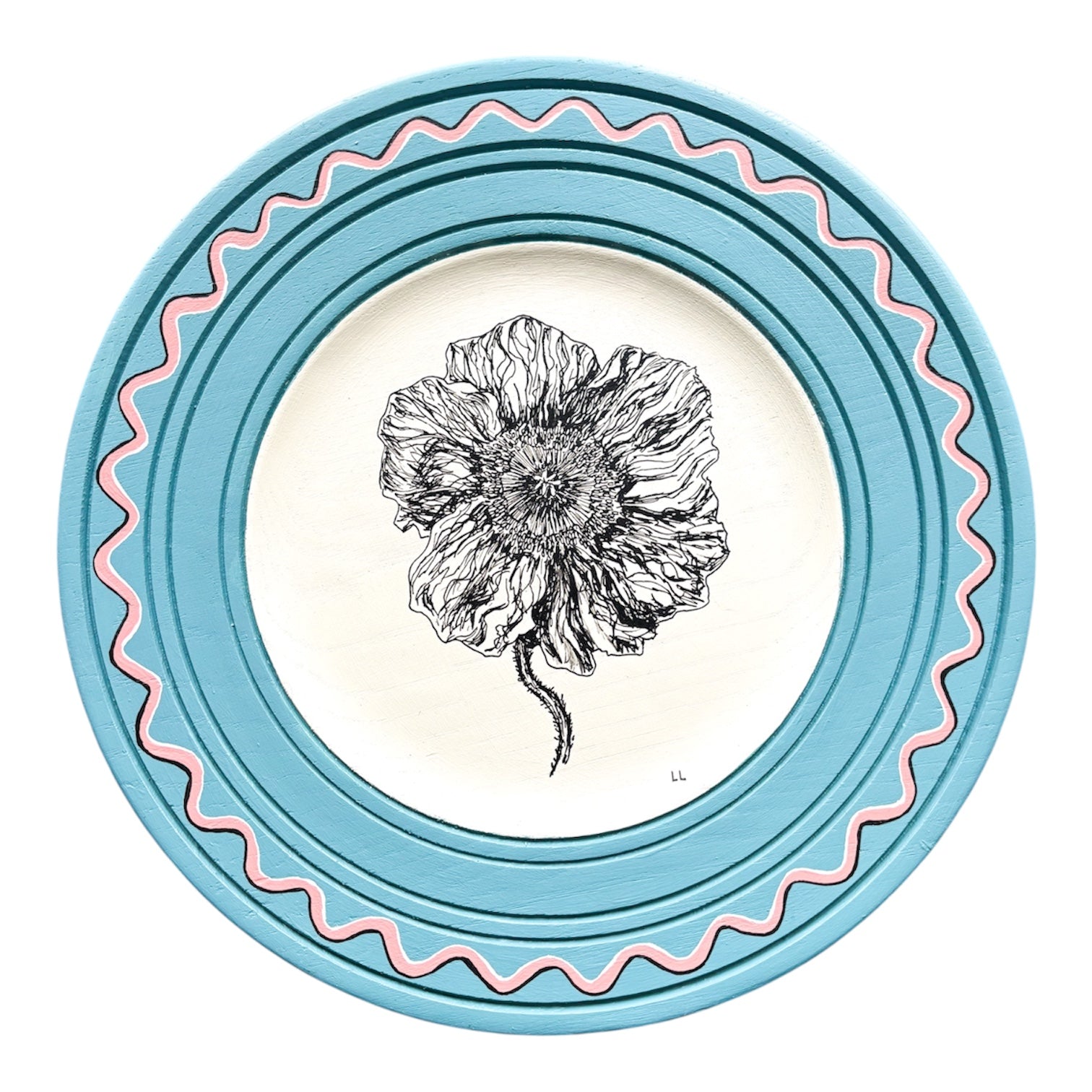 Decorative plate with a floral design and blue border on a white background