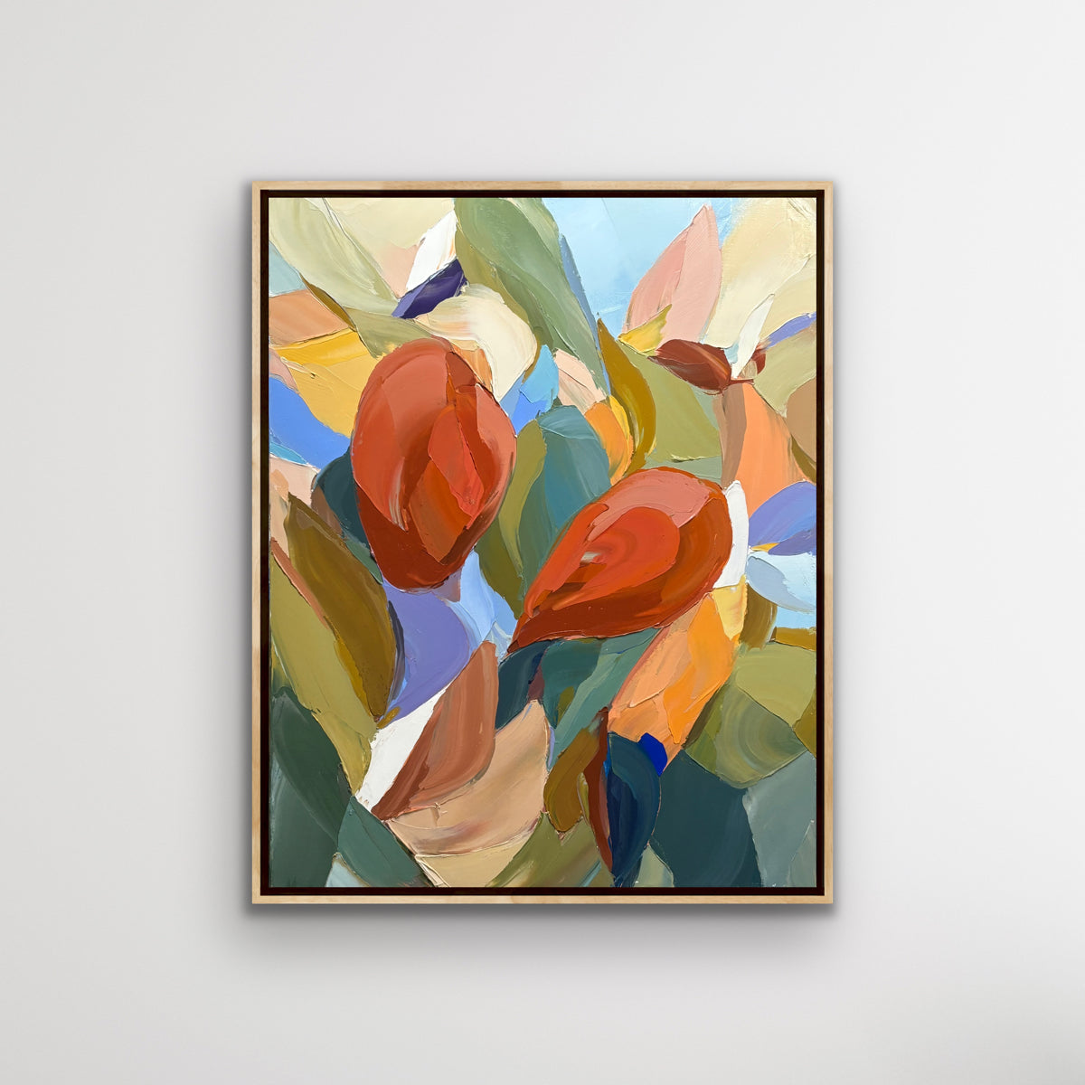 Framed abstract palette knife artwork with colorful leaves on a light gray background