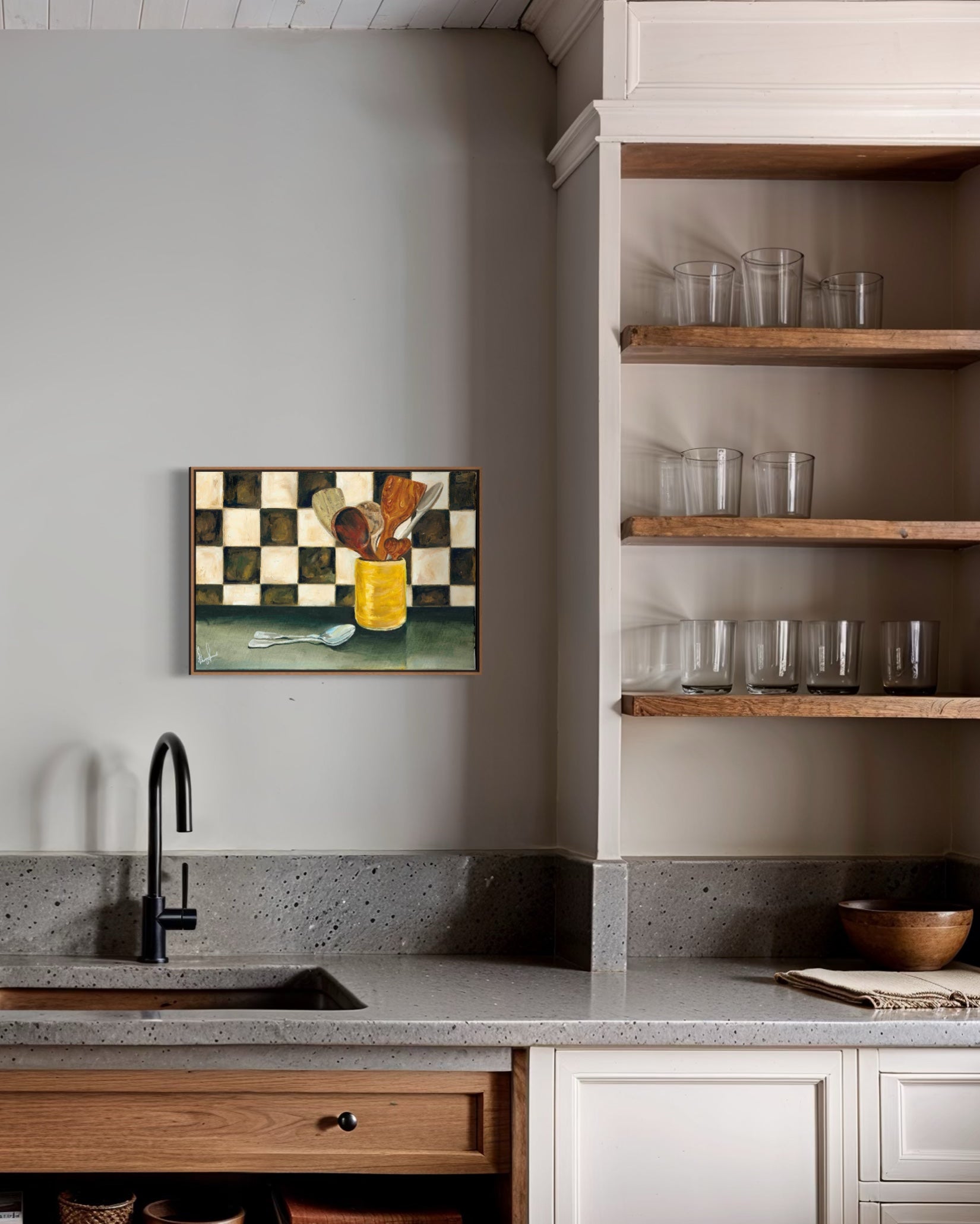 Modern kitchen with concrete countertop, wooden shelves, and abstract art on the wall.