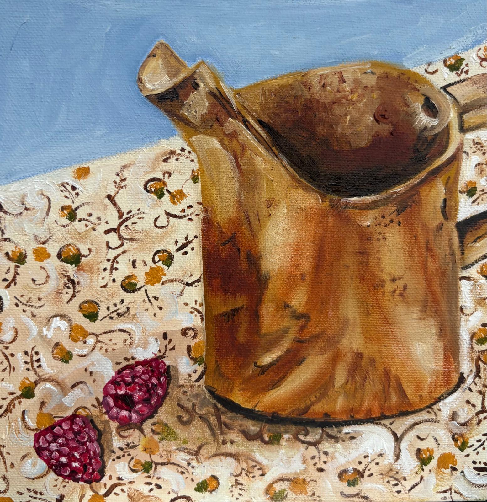 Copper Jug on a decorative fabric background