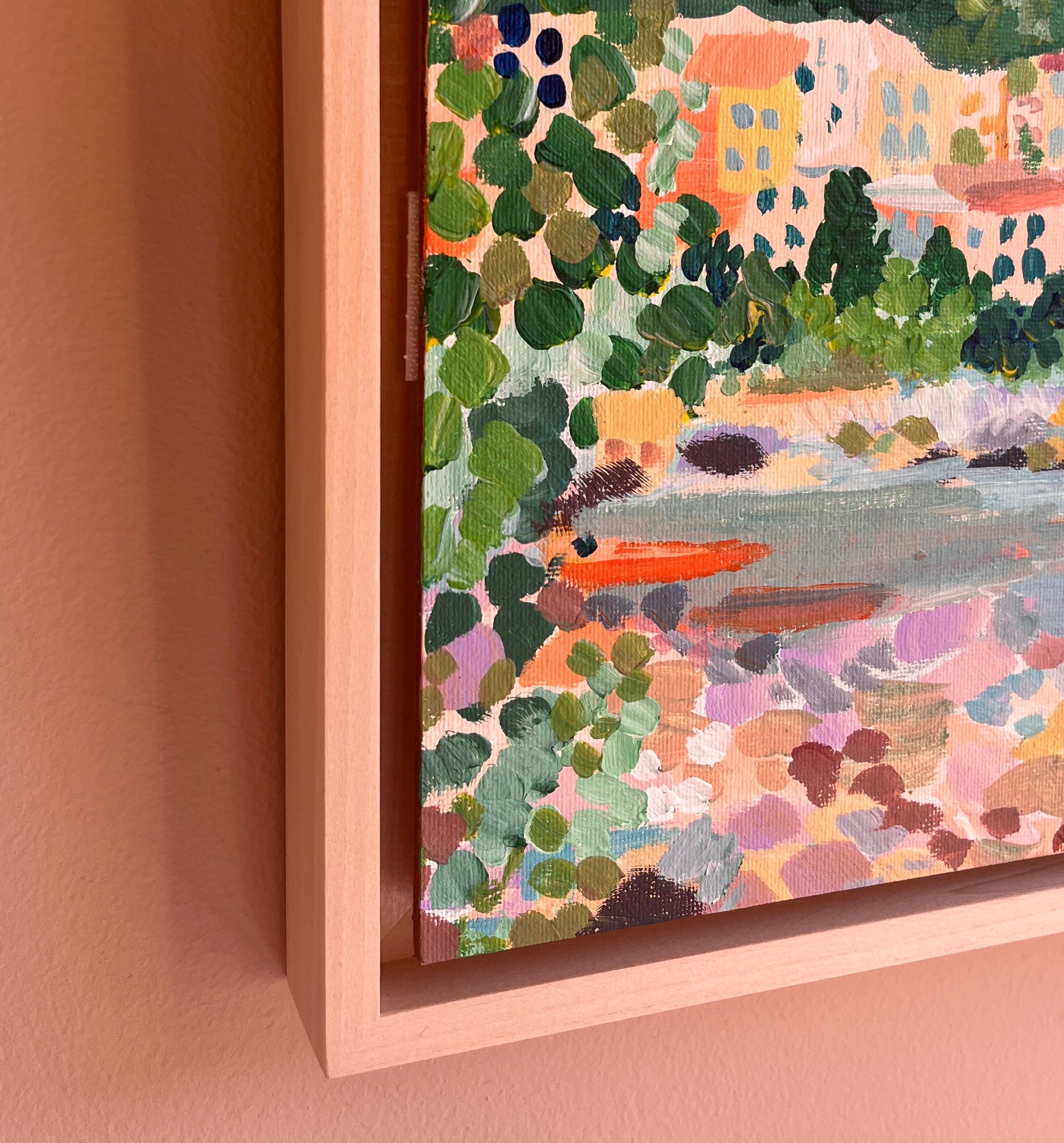 Detail shot of a colourful painting with light frame