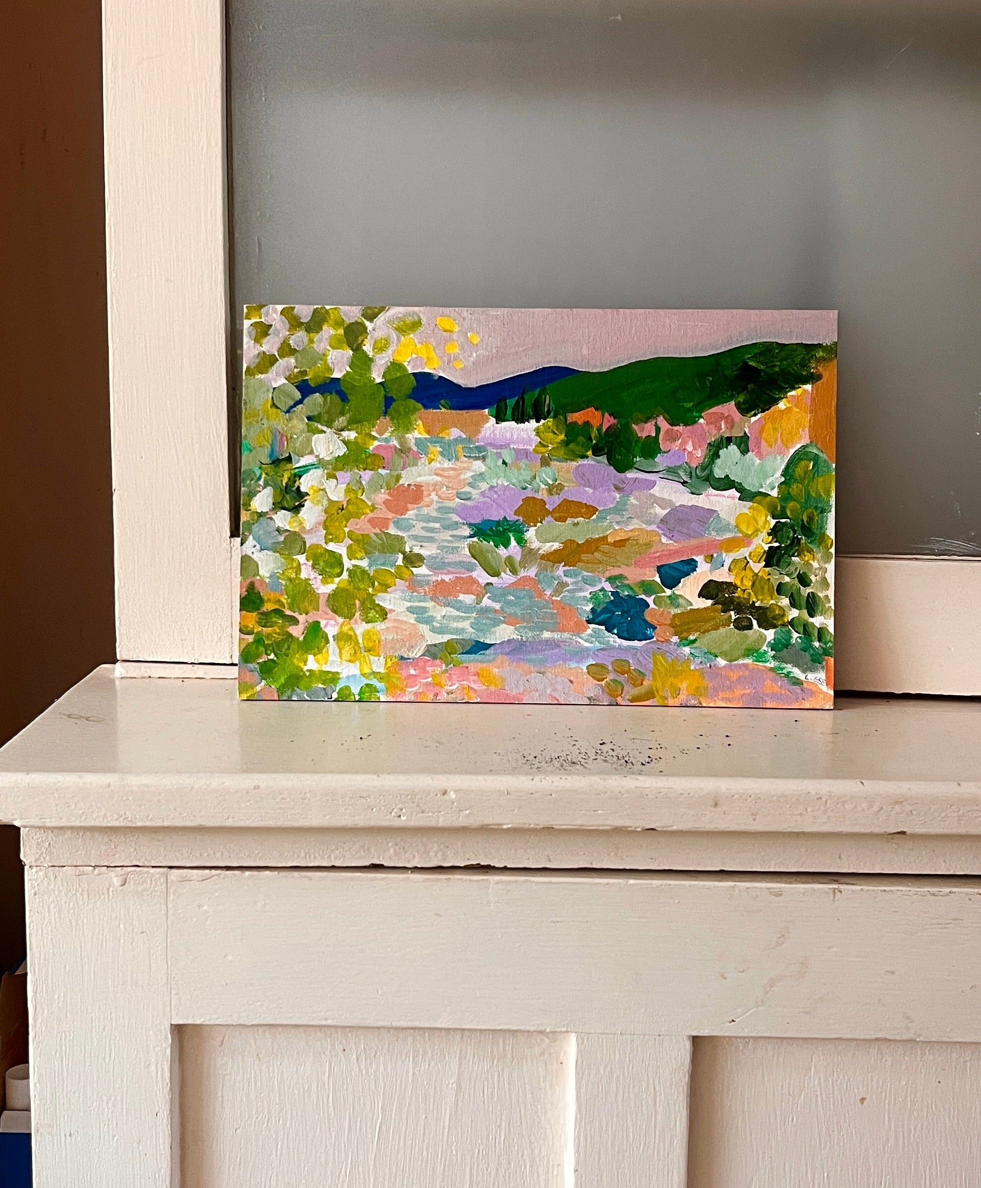 Colourful art on antique dresser