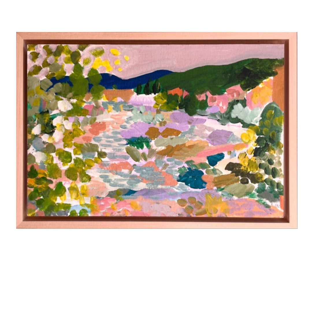 Colorful abstract landscape painting in a wooden frame on a white background