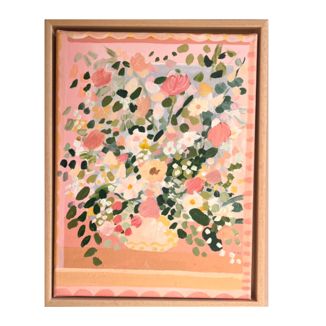 Framed artwork with floral design on a pink background