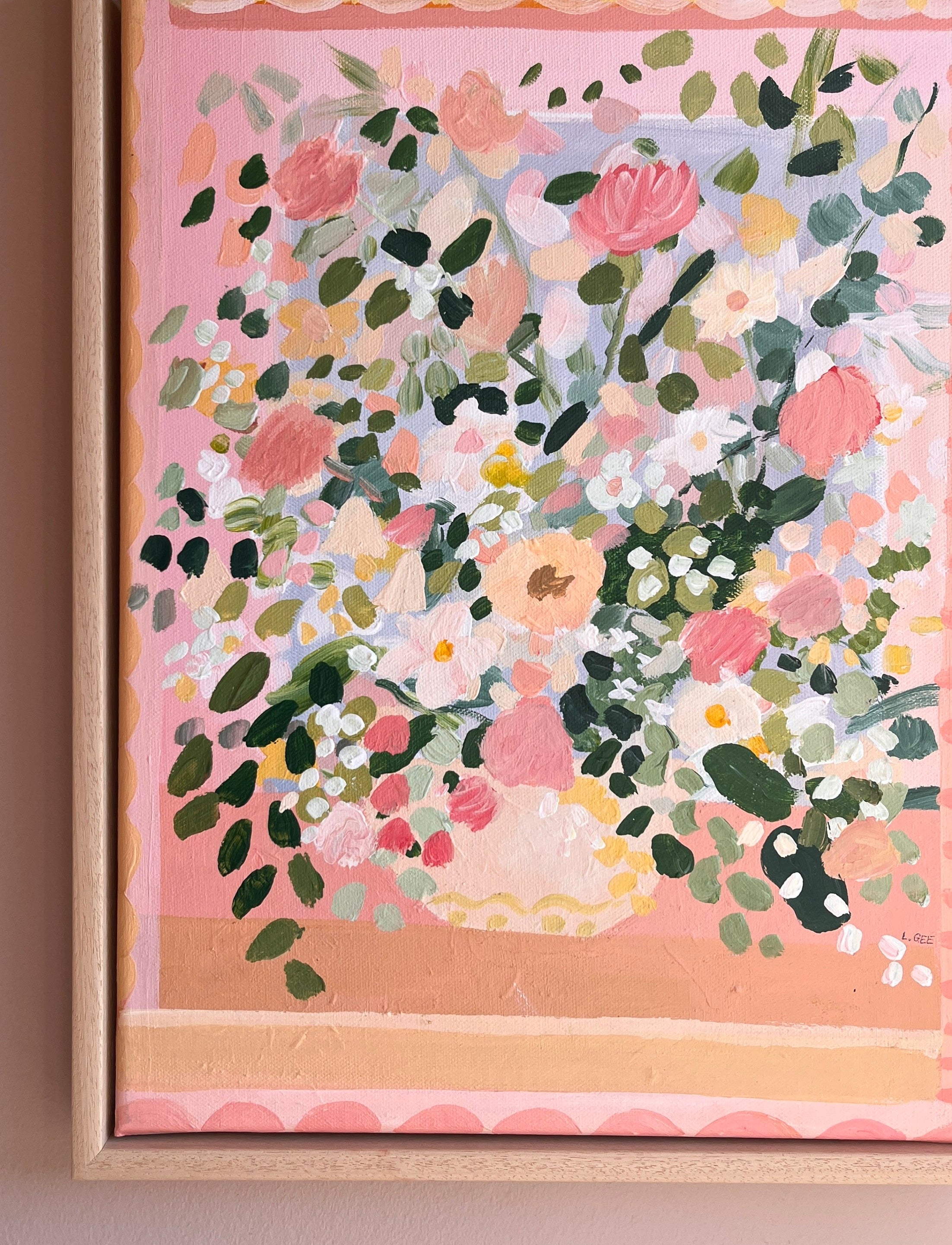 Framed floral artwork with pink and green tones on a pink background