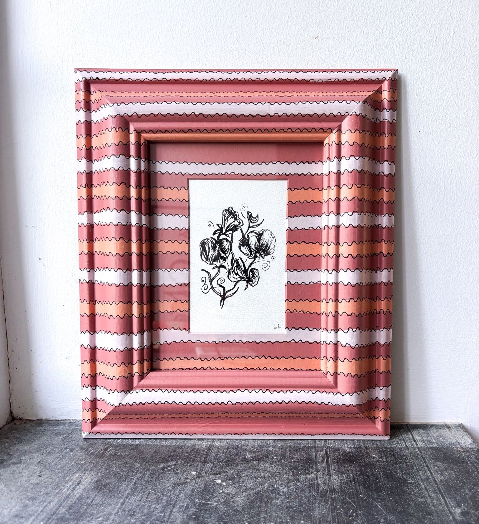 Squiggle hand painted from with pen and ink sweat pea drawing inside.