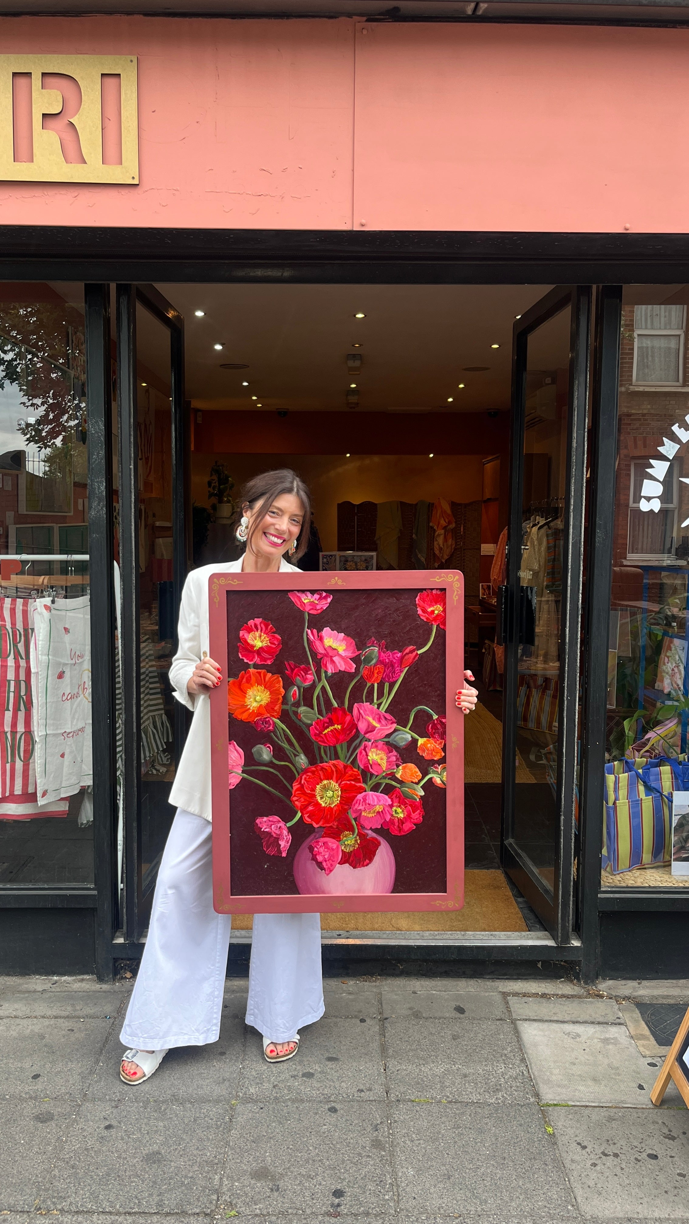 Floral Painting being held by women