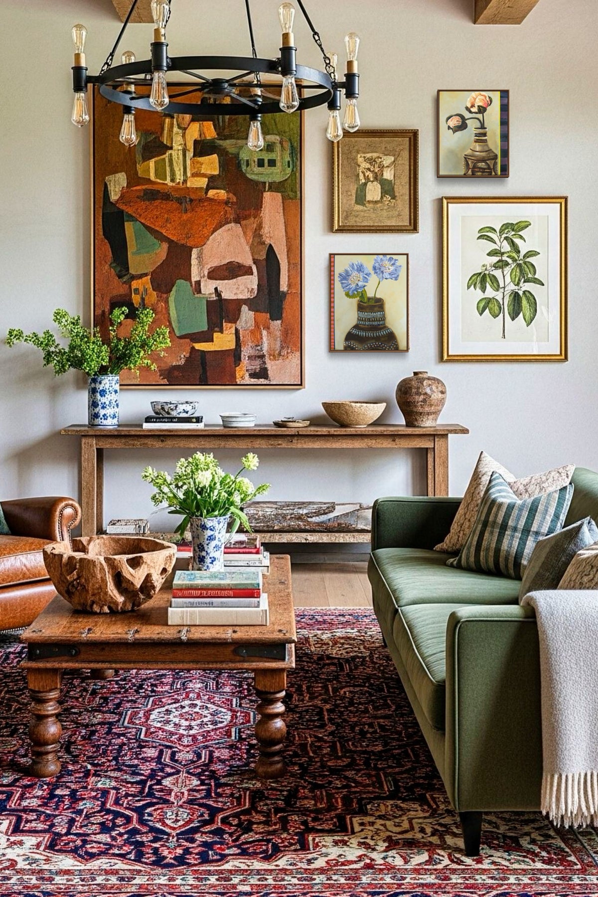 A styled living room interior featuring a large abstract painting above a console table, a green sofa with patterned pillows, a wooden coffee table, a red patterned rug, and multiple framed botanical and abstract artworks on the wall.
