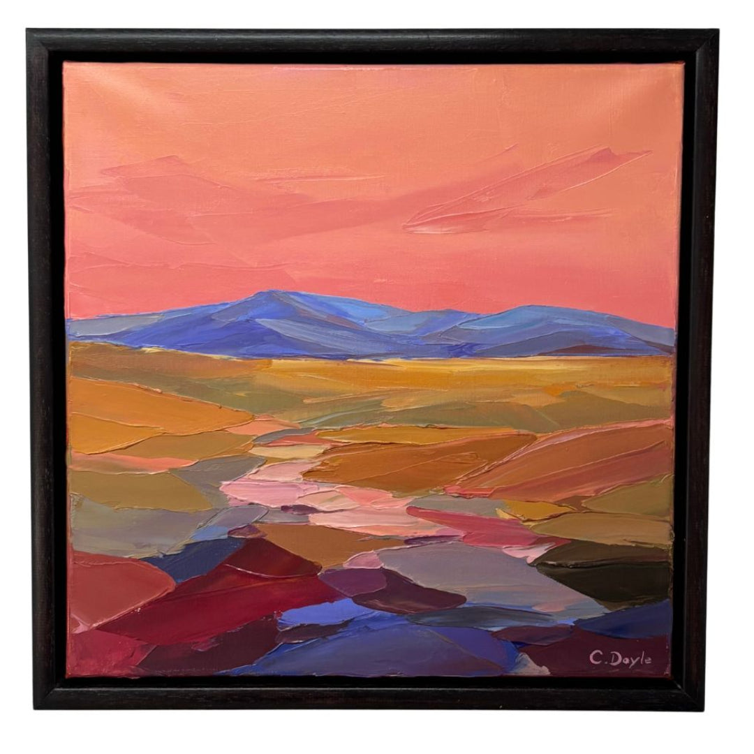 Framed abstract landscape painting with a colorful sky and mountains.