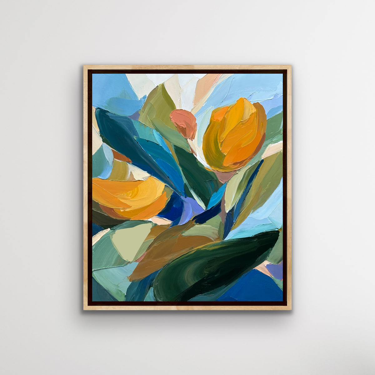 Framed abstract artwork from Connor j Doyle with colorful flowers on a white wall
