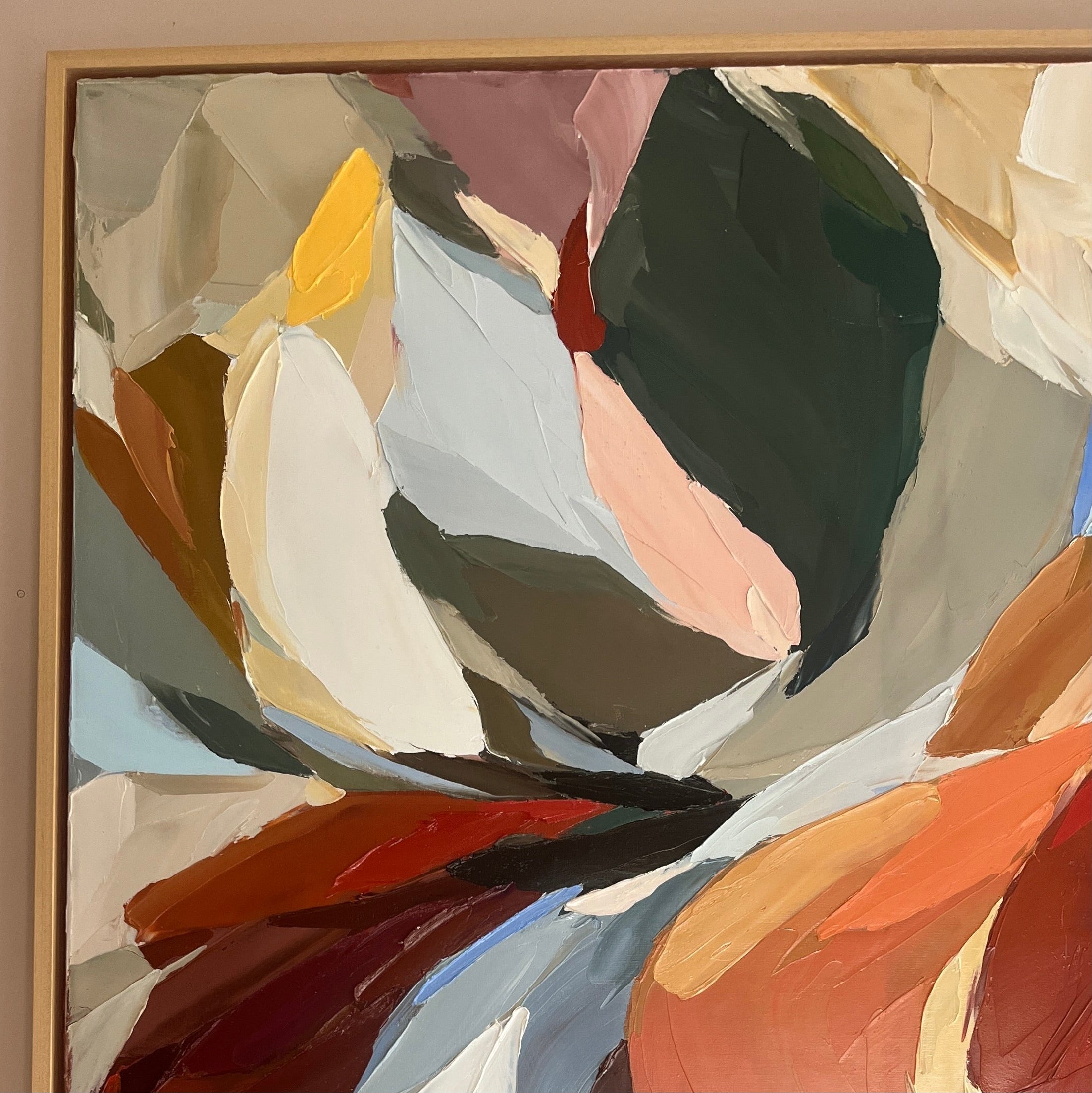 Abstract art painting with swirling colors on a wall