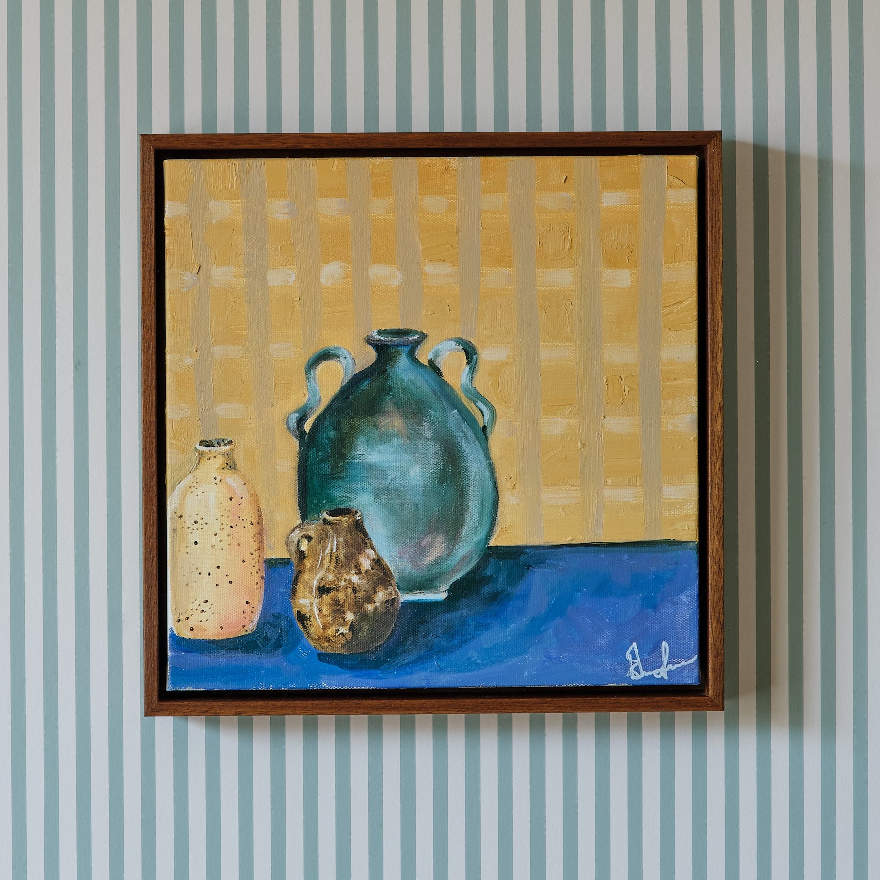 Painting of three pots in a wooden frame set againts stripe wallpaper by Emma Gurner
