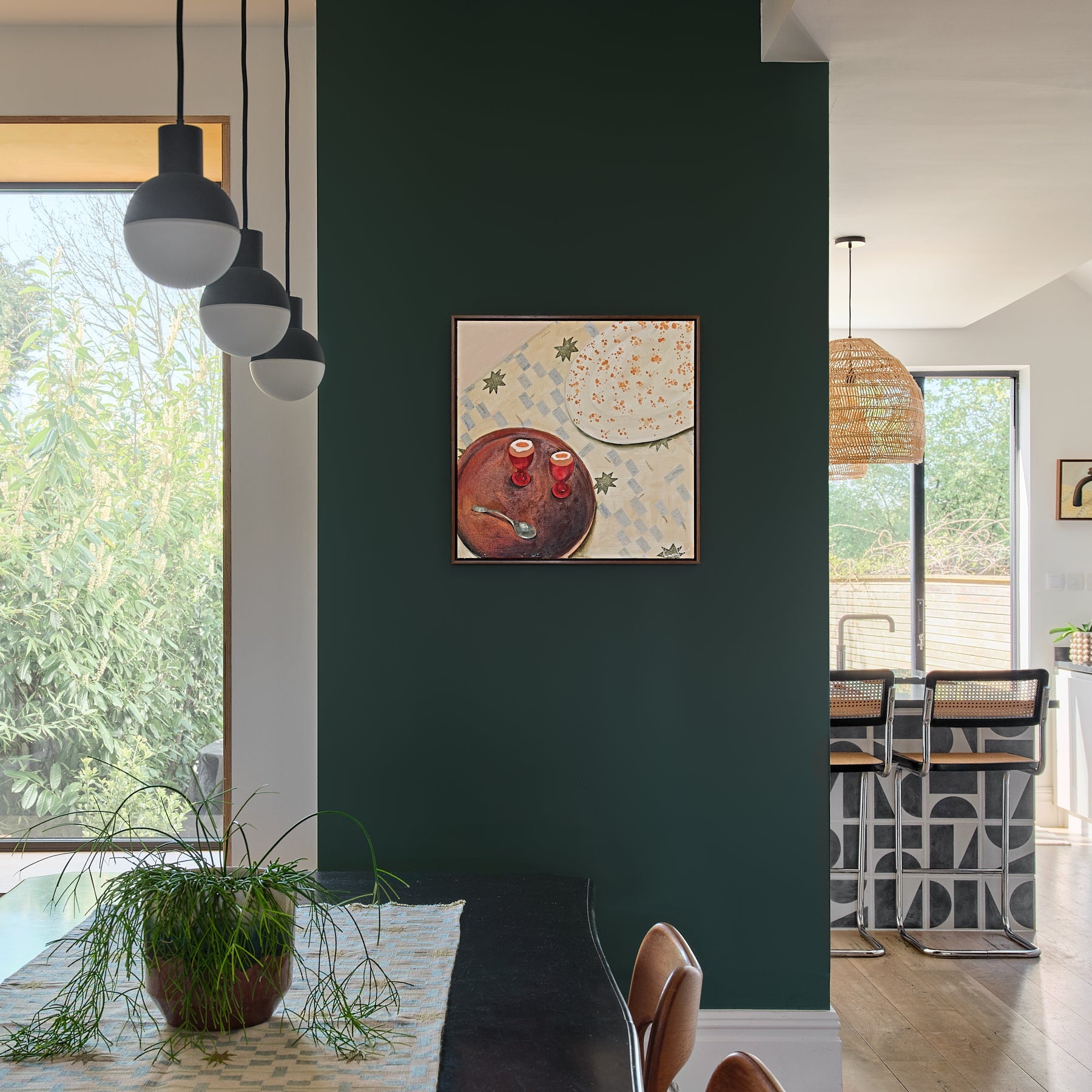 Painting of boiled eggs on green living room wall 