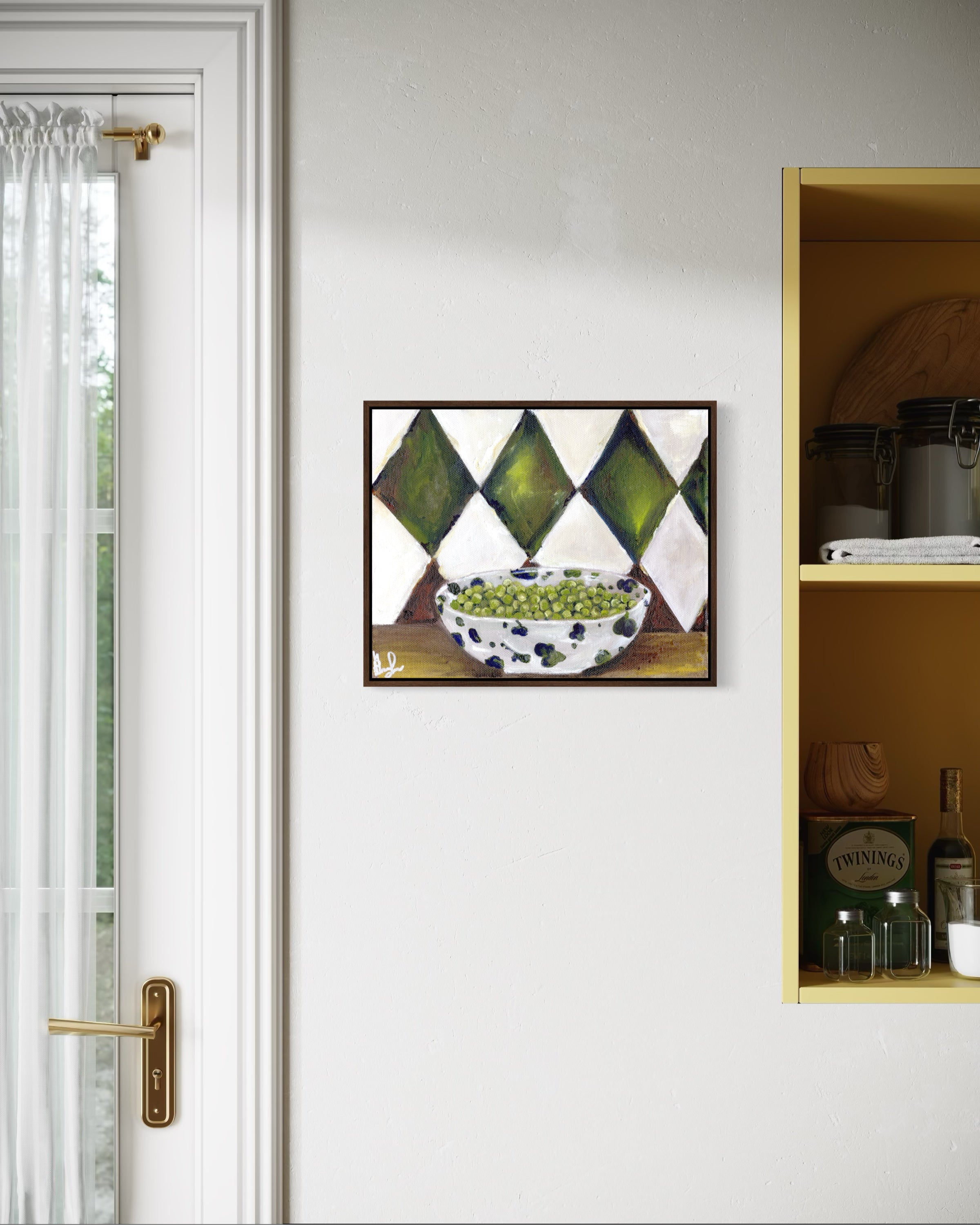 Framed artwork on a wall with a door and shelf in the background