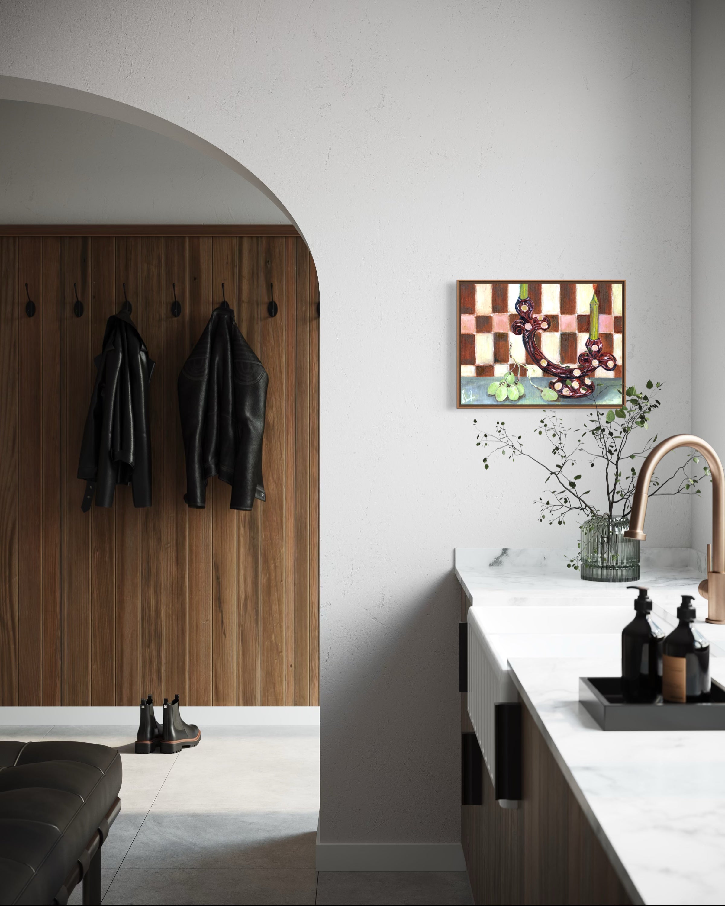 Modern kitchen with wooden wall, coat hooks, and a colorful abstract painting.