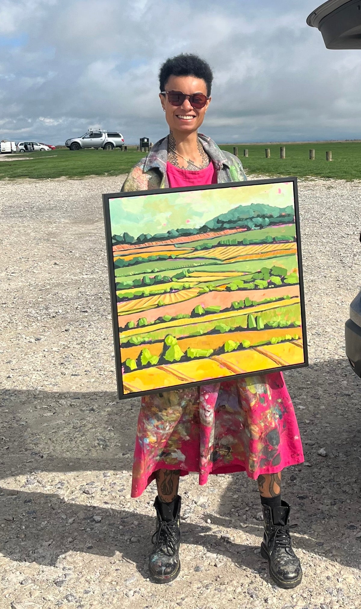 Artist holding painting 