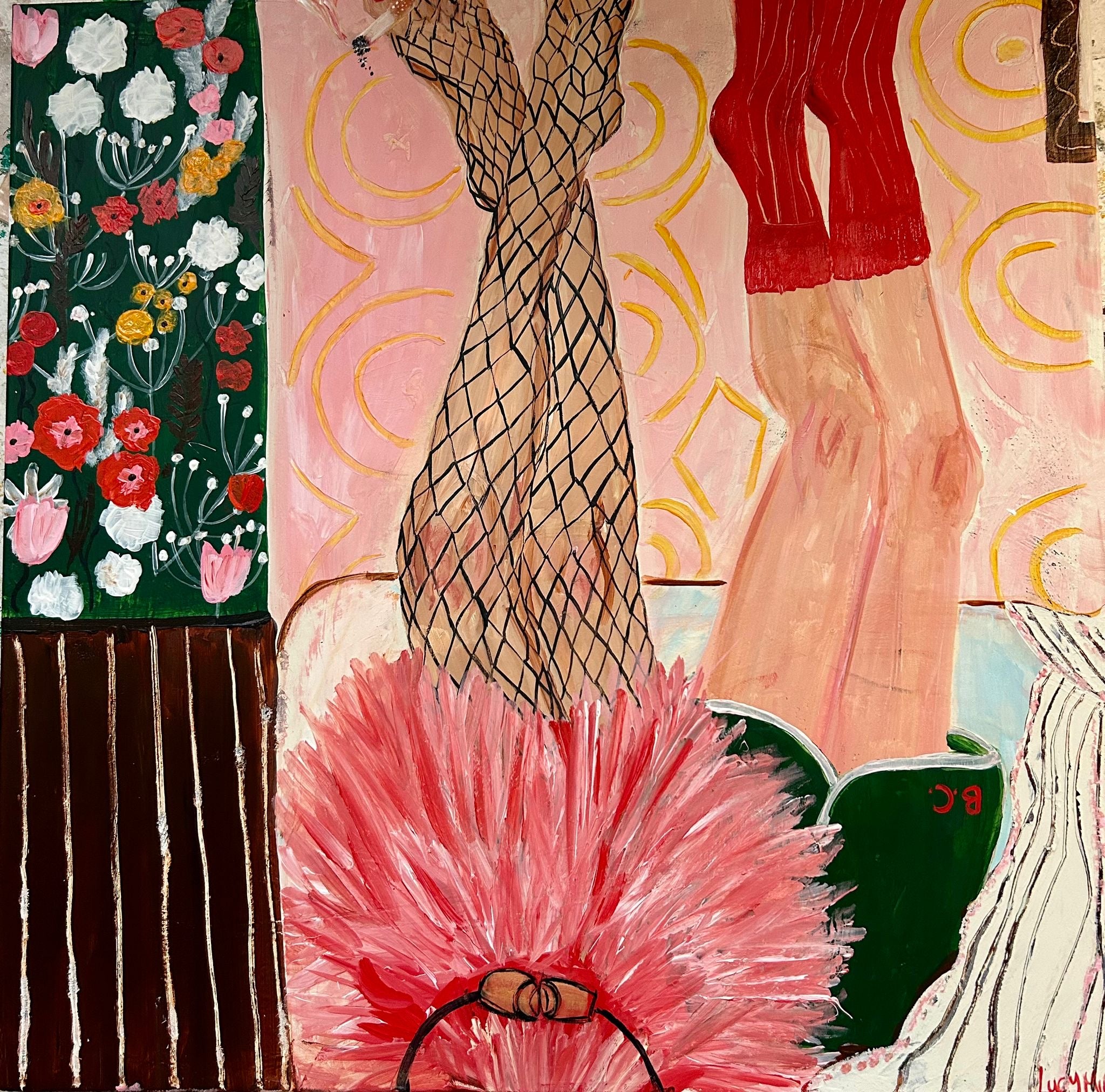 Image of girls with legs up wearing fish net tights, red socks ad floral wallpaper. 