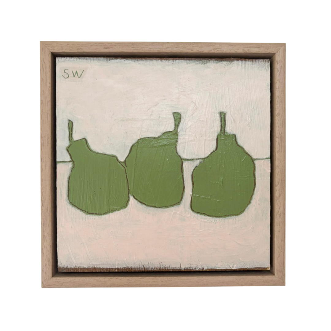 A framed square painting featuring three green abstract pear-like shapes on a light beige background, enclosed in a natural wood frame.